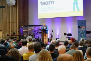 Lee McMunn speaking at Reach 2026