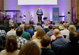 Dan Hubbard speaking at the Reach Conference 2026