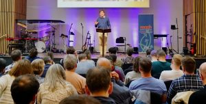 Josh Johnston speaking at the Reach Conference 2026